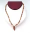 Necklace: Surfboard pendant on coconut shell 