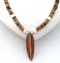 Necklace: Surfboard pendant on coconut shell 