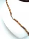 Necklace: Surfboard pendant on coconut shell 